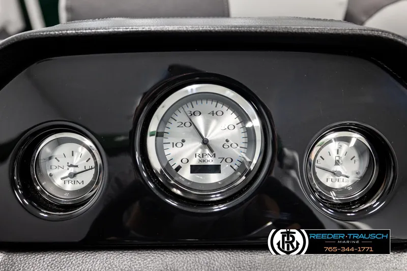 Slide: The Image of Dashboard of 2026 Bennington SLJSF with RPM, trim, and fuel gauges. - 34