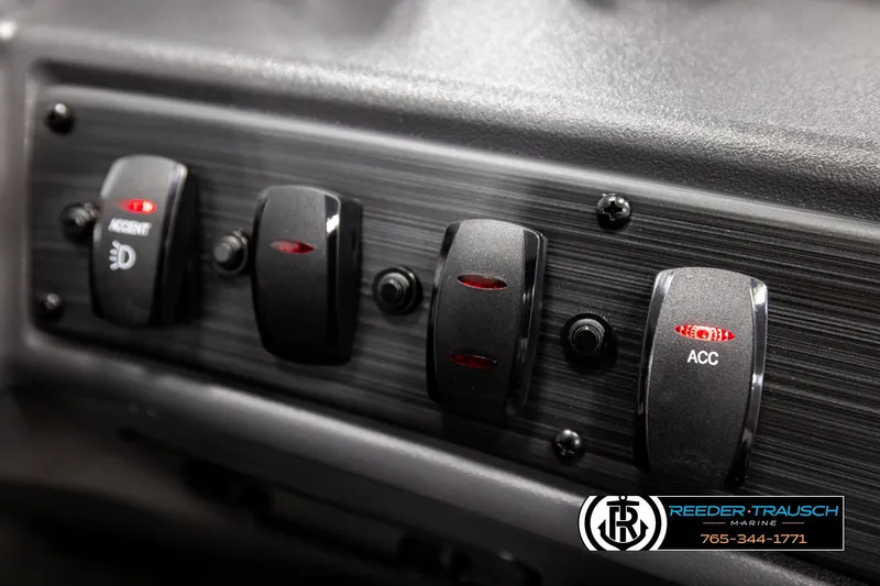 Slide: The Image of Control panel of 2026 Bennington SLJSF boat with labeled switches and Reeder-Trausch Marine logo. - 37