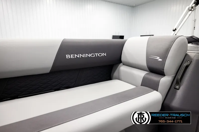 Slide: The Image of 2026 Bennington SLJSF boat interior with gray and black seating, featuring logo embroidery. - 42