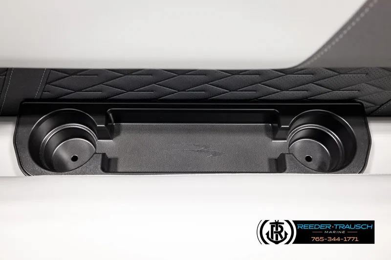 Slide: The Image of 2026 Bennington SLJSF interior cup holders with diamond-patterned upholstery detail. - 44