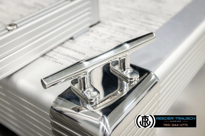 Slide: The Image of Chrome boat cleat on 2026 Bennington SLJSF, Reeder-Trausch Marine branding visible. - 52