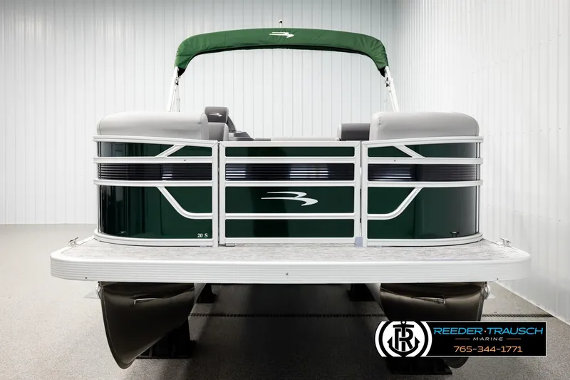 Slide: The Image of 2026 Bennington SLJSF pontoon boat with green canopy in showroom. - 8
