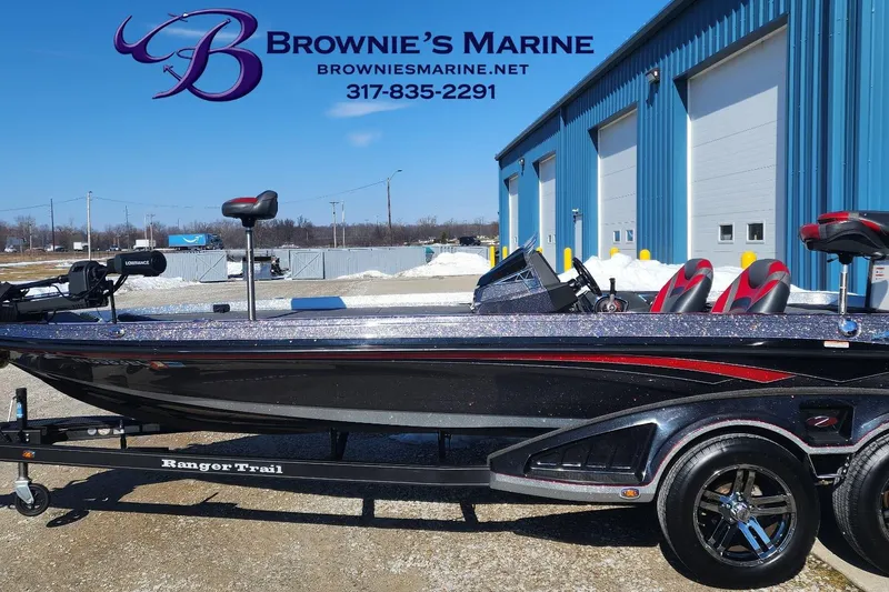 The Image of 2019 Ranger Z520L boat at Brownie's Marine dealership, parked outside blue building. - 1