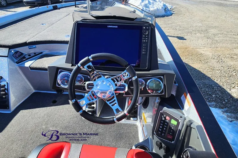 Slide: The Image of 2019 Ranger Z520L boat dashboard with steering wheel and Lowrance display. - 7