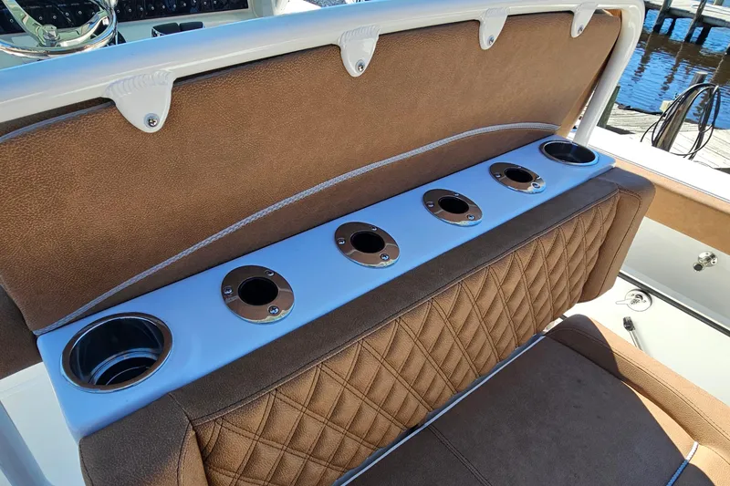 Slide: The Image of 2026 Sea Hunt Ultra 275 Coffin Box boat seating with integrated cup holders. - 21