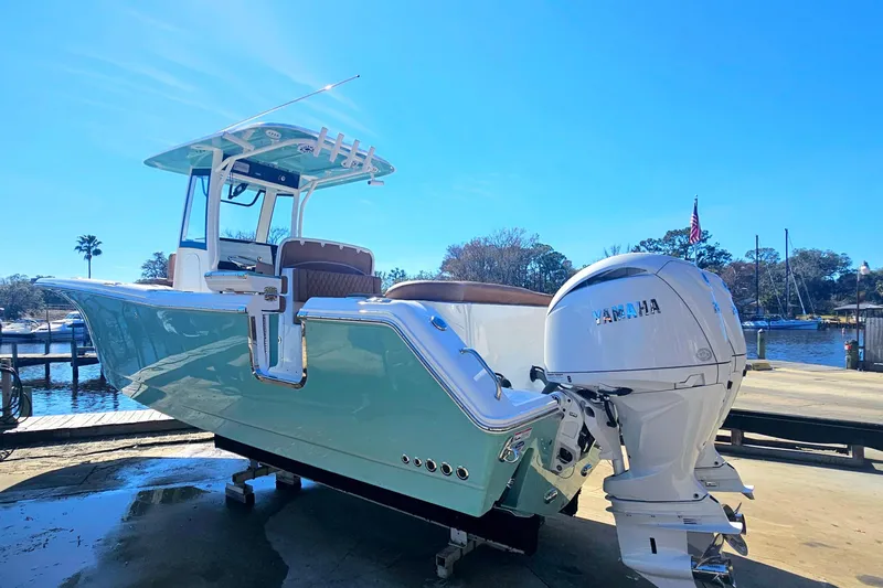 Slide: The Image of 2026 Sea Hunt Ultra 275 Coffin Box boat with Yamaha engine at dockside. - 3