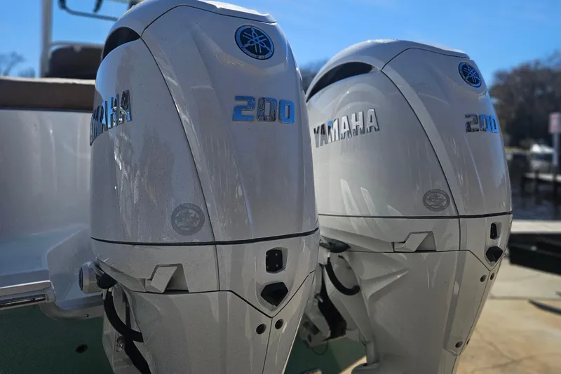 Slide: The Image of Twin Yamaha 200 outboard engines on a 2026 Sea Hunt Ultra 275 Coffin Box boat. - 4