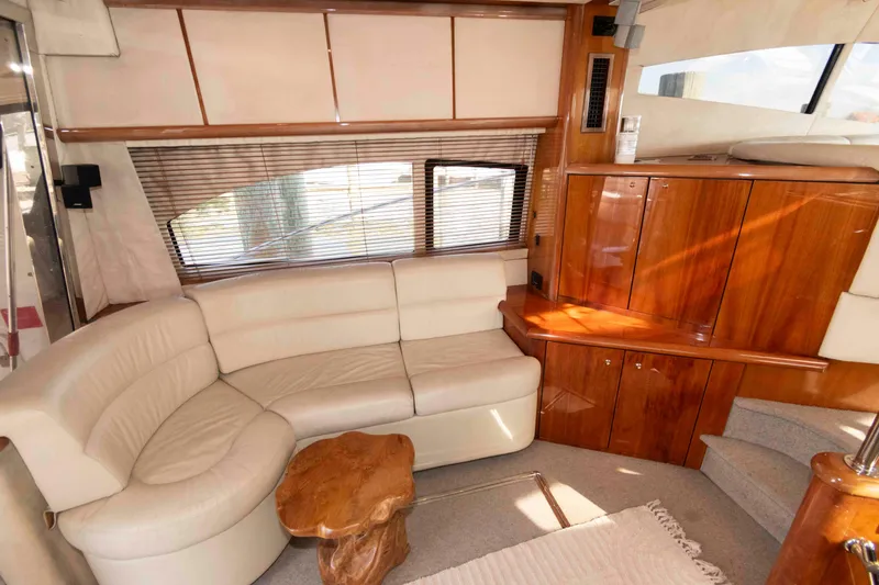 Slide: The Image of Luxurious interior of 2003 Sunseeker Manhattan 56 yacht with leather seating and wooden cabinetry. - 11