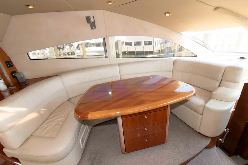 Slide: The Image of Luxurious interior of 2003 Sunseeker Manhattan 56 yacht with elegant seating and wooden table. - 15