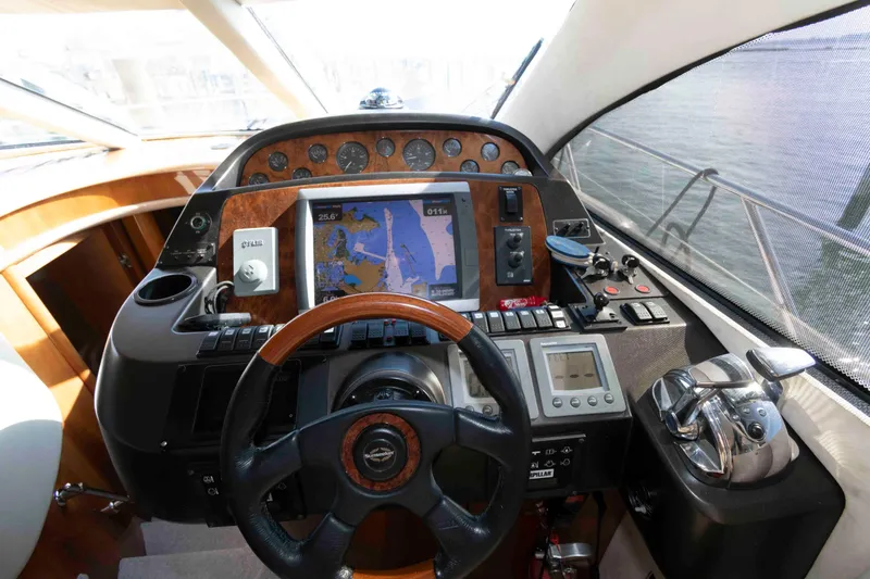 Slide: The Image of Control panel of a 2003 Sunseeker Manhattan 56 yacht with navigation equipment. - 18
