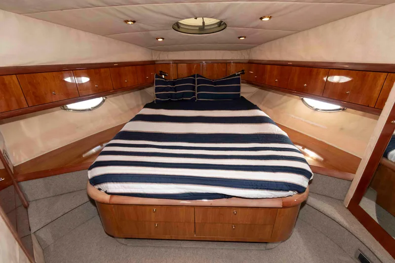 Slide: The Image of Luxurious cabin interior of 2003 Sunseeker Manhattan 56 yacht with striped bedding. - 22