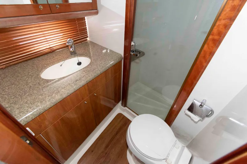Slide: The Image of Bathroom interior of 2003 Sunseeker Manhattan 56 yacht with sink, toilet, and shower. - 23
