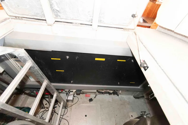 Slide: The Image of Engine room of 2003 Sunseeker Manhattan 56 yacht with visible ladder and equipment. - 27