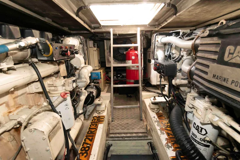 Slide: The Image of Engine room of 2003 Sunseeker Manhattan 56 yacht, featuring CAT marine engines and equipment. - 28