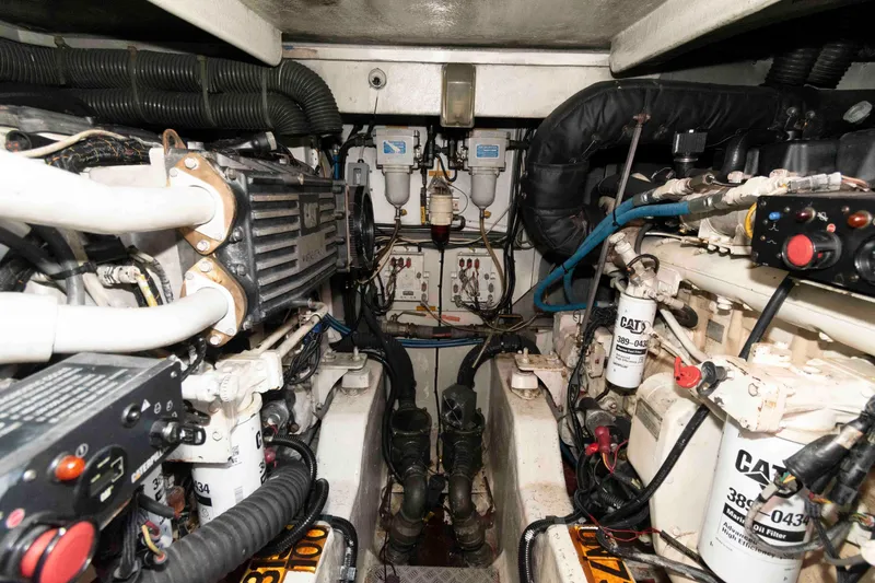 Slide: The Image of Engine room of 2003 Sunseeker Manhattan 56 yacht, featuring CAT machinery and components. - 29