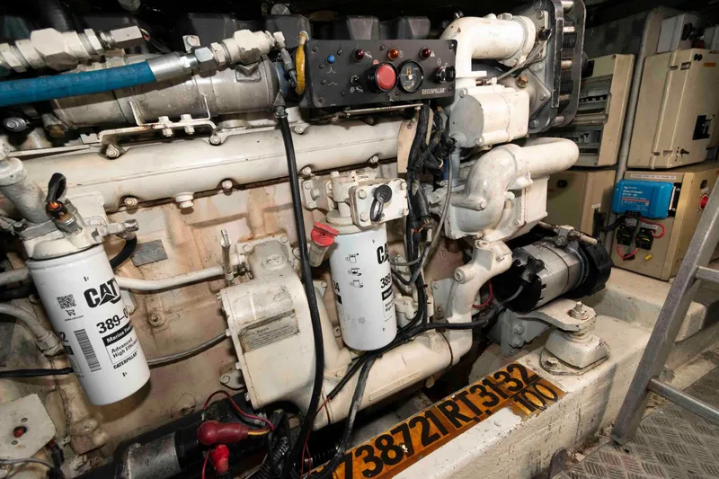 Slide: The Image of Engine room of a 2003 Sunseeker Manhattan 56 yacht, featuring a Caterpillar engine. - 33