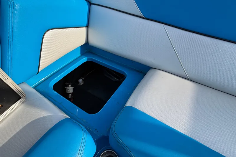 Slide: The Image of Blue and white seating with storage compartment in 2017 MasterCraft NXT20 boat. - 23