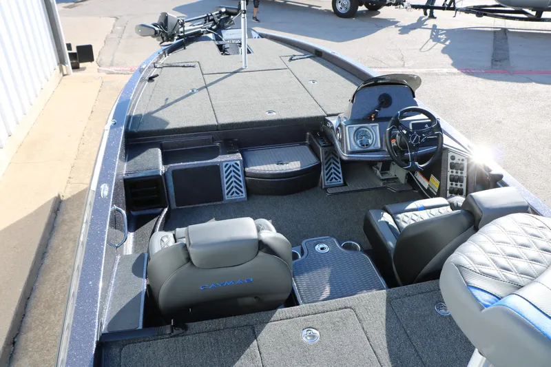 Slide: The Image of 2027 Caymas 201 Pro boat interior with steering wheel and seating. - 19