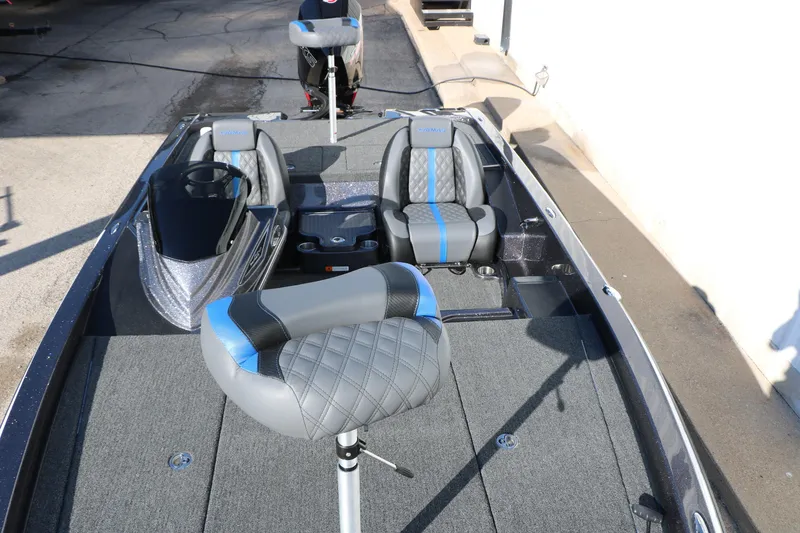 Slide: The Image of 2027 Caymas 201 Pro boat interior with gray and blue seating, showcasing modern design. - 23
