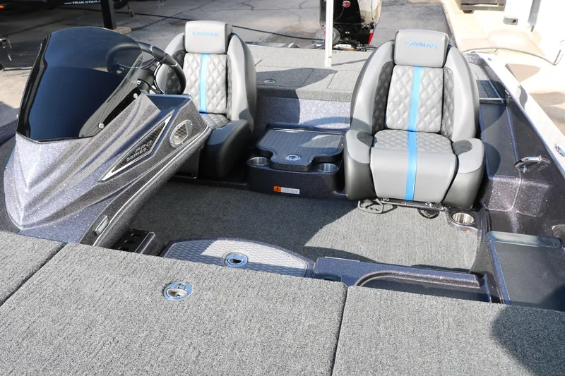 Slide: The Image of 2027 Caymas 201 Pro boat interior with dual seats and modern dashboard. - 25