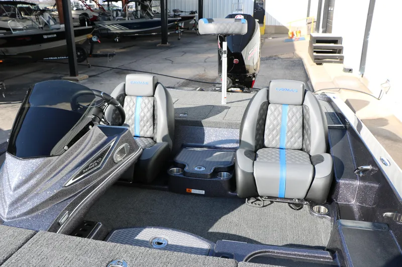 Slide: The Image of 2027 Caymas 201 Pro boat interior with dual seats and modern dashboard design. - 26