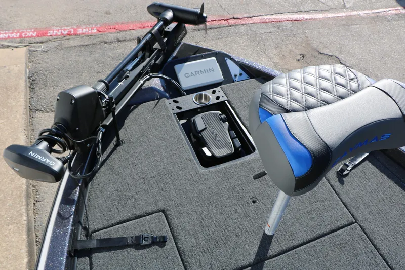 Slide: The Image of 2027 Caymas 201 Pro boat deck with Garmin equipment and cushioned seat. - 27