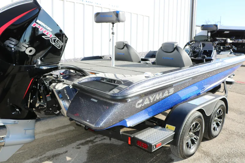 Slide: The Image of 2027 Caymas 201 Pro boat with Mercury 250 Pro XS engine, parked on a trailer. - 3