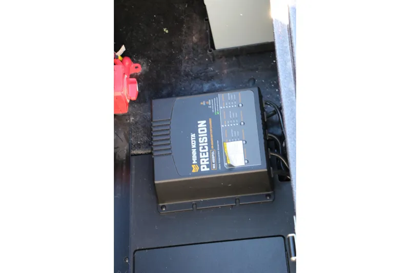 Slide: The Image of Minn Kota Precision charger in 2027 Caymas 201 Pro boat compartment. - 31