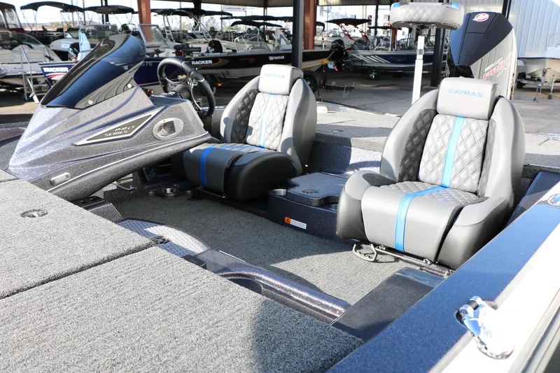 Slide: The Image of 2027 Caymas 201 Pro boat interior with dual seats and modern dashboard design. - 8