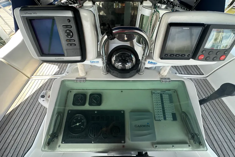 Slide: The Image of Cockpit of 1999 Beneteau Oceanis 352 with Garmin navigation equipment and compass. - 4