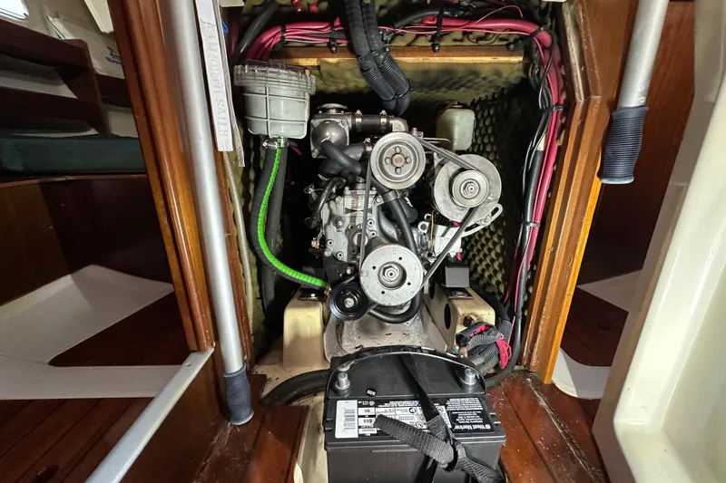 Slide: The Image of Engine compartment of a 1999 Beneteau Oceanis 352 sailboat, showcasing mechanical components. - 9