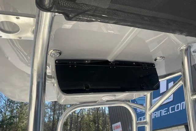 Slide: The Image of T-top storage compartment on 2026 Key West 203 FS boat, featuring sturdy metal framework. - 10
