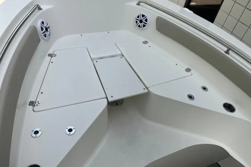 Slide: The Image of 2026 Key West 189 FS boat interior with storage compartments and speakers. - 15