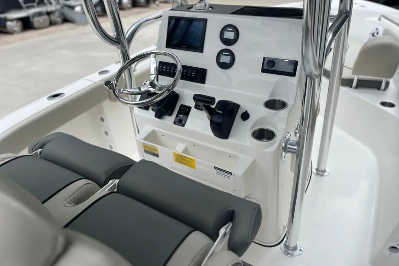 Slide: The Image of 2026 Key West 189 FS boat console with steering wheel and controls. - 3
