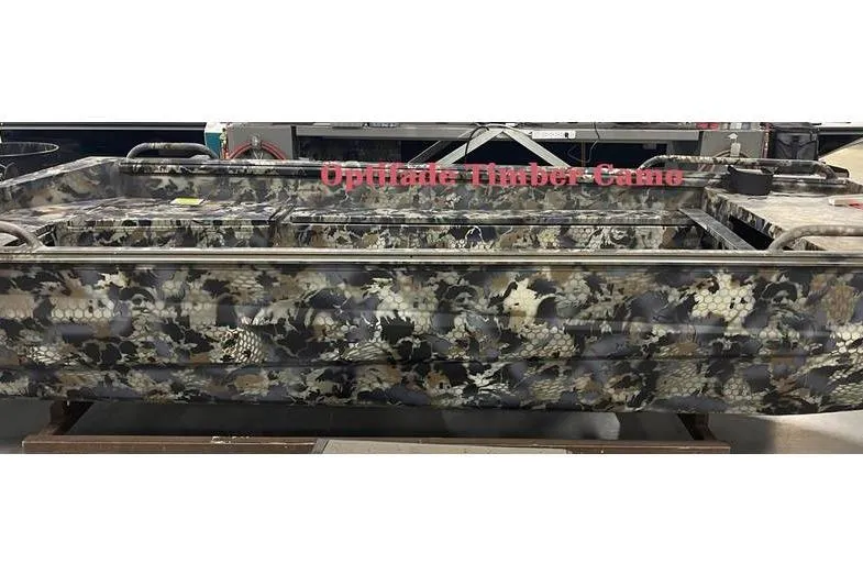 Slide: The Image of 2026 Excel Switchblade boat with Optifade Timber Camo design, side view. - 13