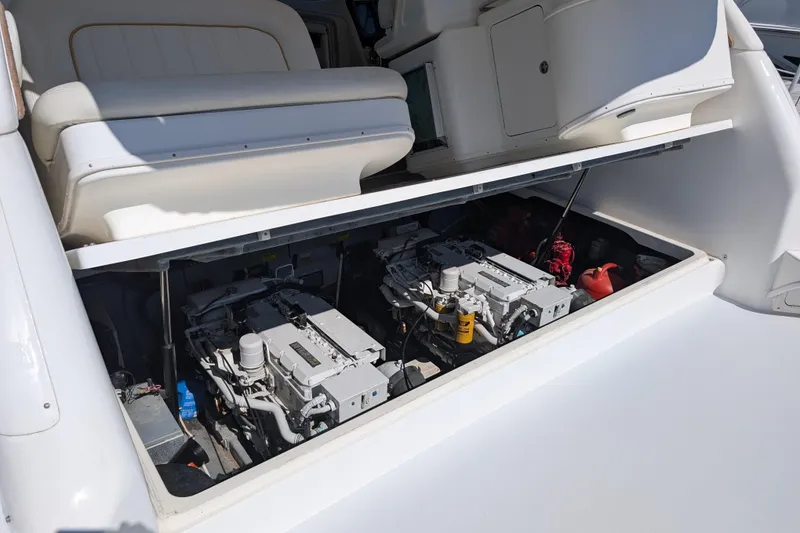 Slide: The Image of 1999 Sea Ray 370 Express Cruiser engine compartment with dual engines visible. - 14