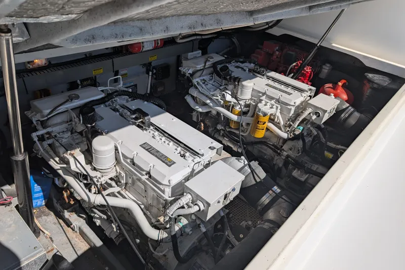 Slide: The Image of Engine compartment of a 1999 Sea Ray 370 Express Cruiser with dual engines. - 15