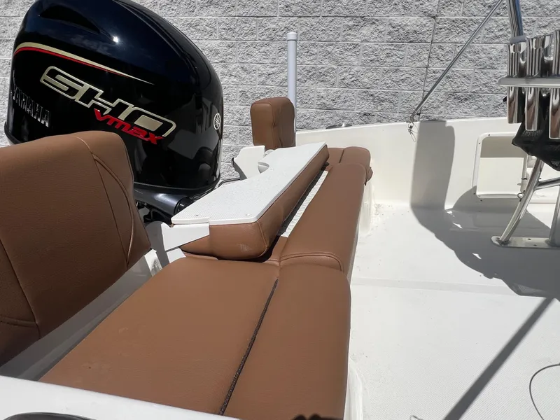 Slide: The Image of 2026 Pioneer 180 Islander boat interior with Yamaha SHO VMAX engine, brown seating, and white deck. - 4
