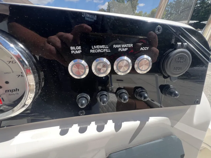 Slide: The Image of Control panel of 2026 Pioneer 180 Islander boat with switches and USB port. - 9