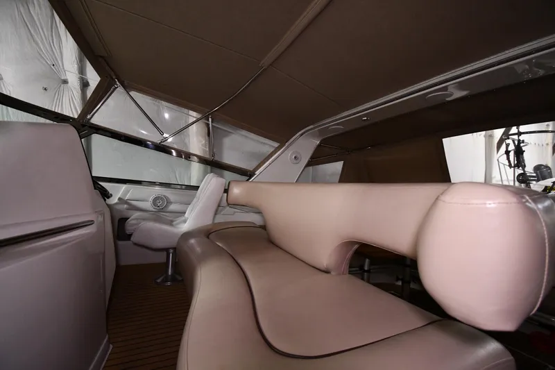 Slide: The Image of Interior of 1995 Sea Ray 440 Sundancer yacht with beige seating and modern design. - 11