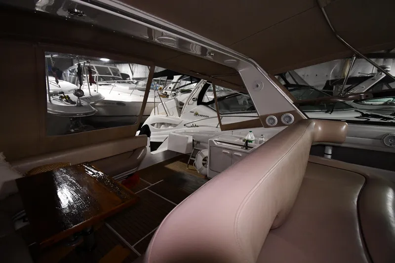 Slide: The Image of Interior view of 1995 Sea Ray 440 Sundancer yacht with seating and table. - 15
