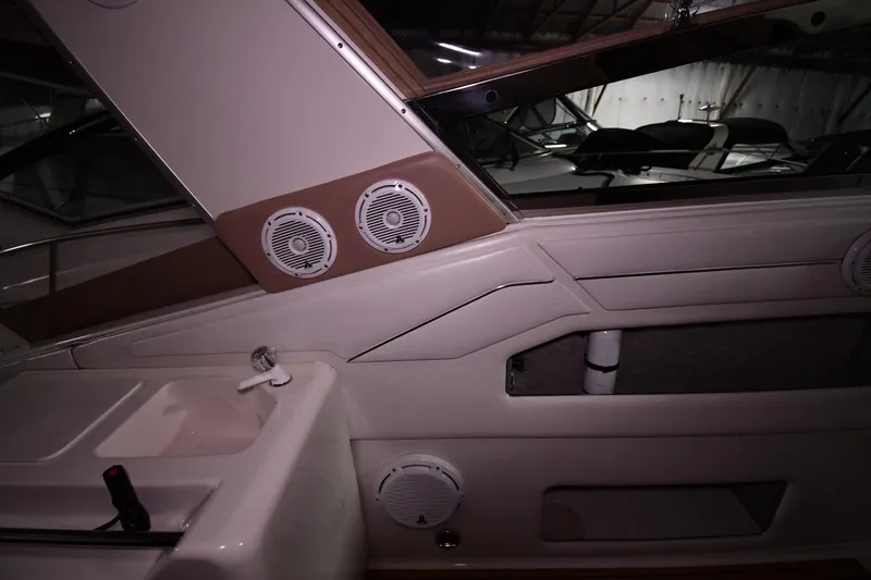 Slide: The Image of Interior of 1995 Sea Ray 440 Sundancer boat with speakers and sink. - 16