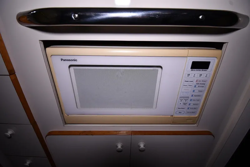 Slide: The Image of Built-in Panasonic microwave in 1995 Sea Ray 440 Sundancer yacht kitchen. - 38