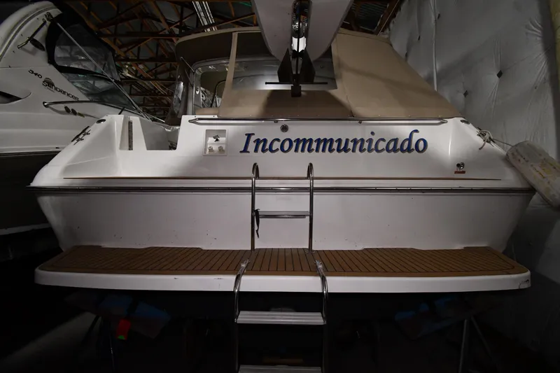 Slide: The Image of 1995 Sea Ray 440 Sundancer boat named "Incommunicado" in storage. - 4