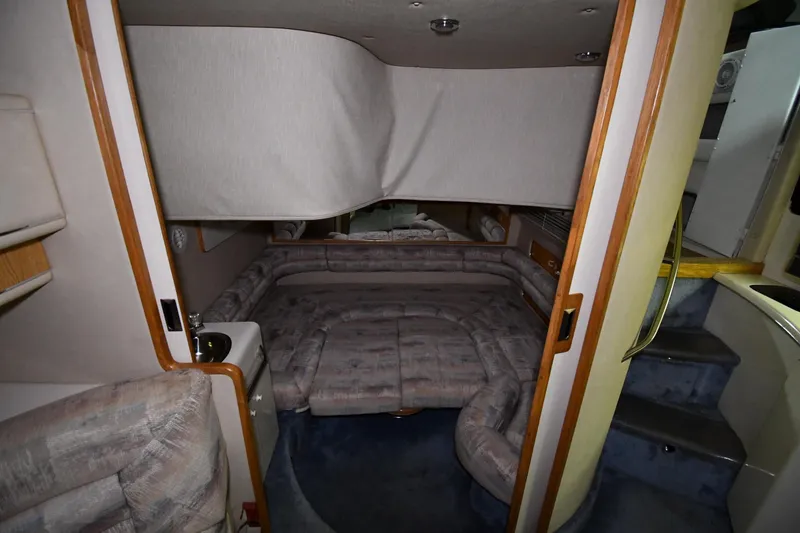 Slide: The Image of Interior cabin of 1995 Sea Ray 440 Sundancer yacht with cozy seating and stairs. - 40