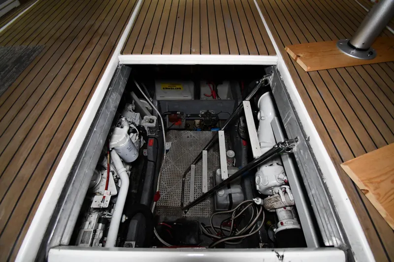 Slide: The Image of Engine compartment of 1995 Sea Ray 440 Sundancer with visible mechanical components. - 45