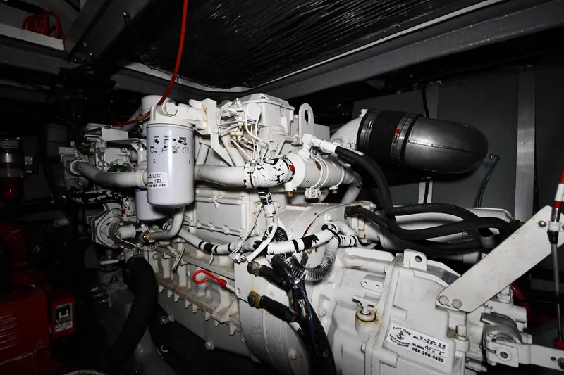 Slide: The Image of Engine room of 1995 Sea Ray 440 Sundancer boat, showcasing detailed machinery components. - 46