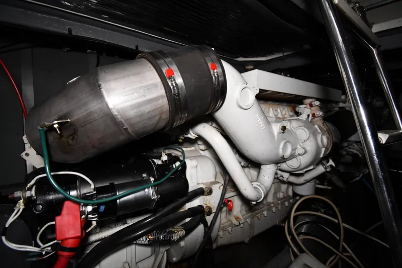 Slide: The Image of Engine compartment of 1995 Sea Ray 440 Sundancer boat, showcasing mechanical components. - 47