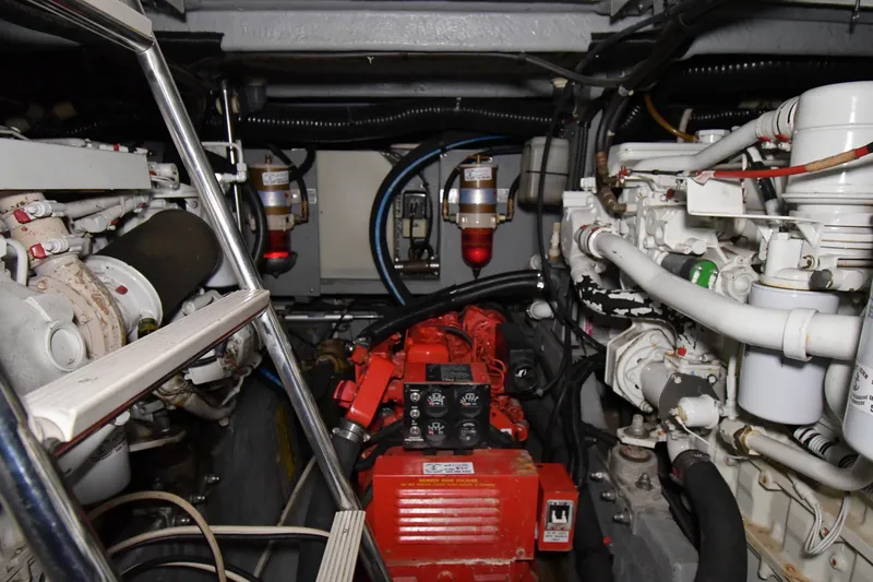 Slide: The Image of Engine room of a 1995 Sea Ray 440 Sundancer with visible machinery and components. - 48
