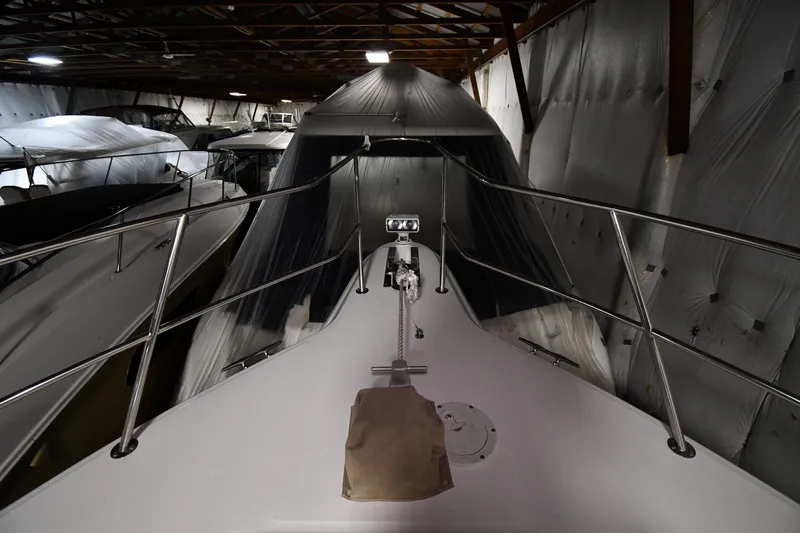 Slide: The Image of 1995 Sea Ray 440 Sundancer yacht stored indoors, covered and secured. - 5